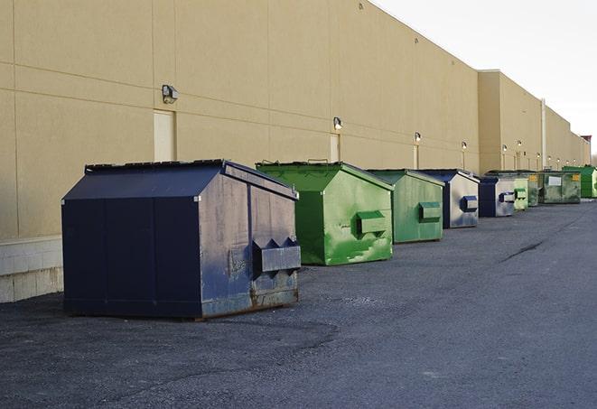 big yellow dumpsters on a construction lot in Adamstown